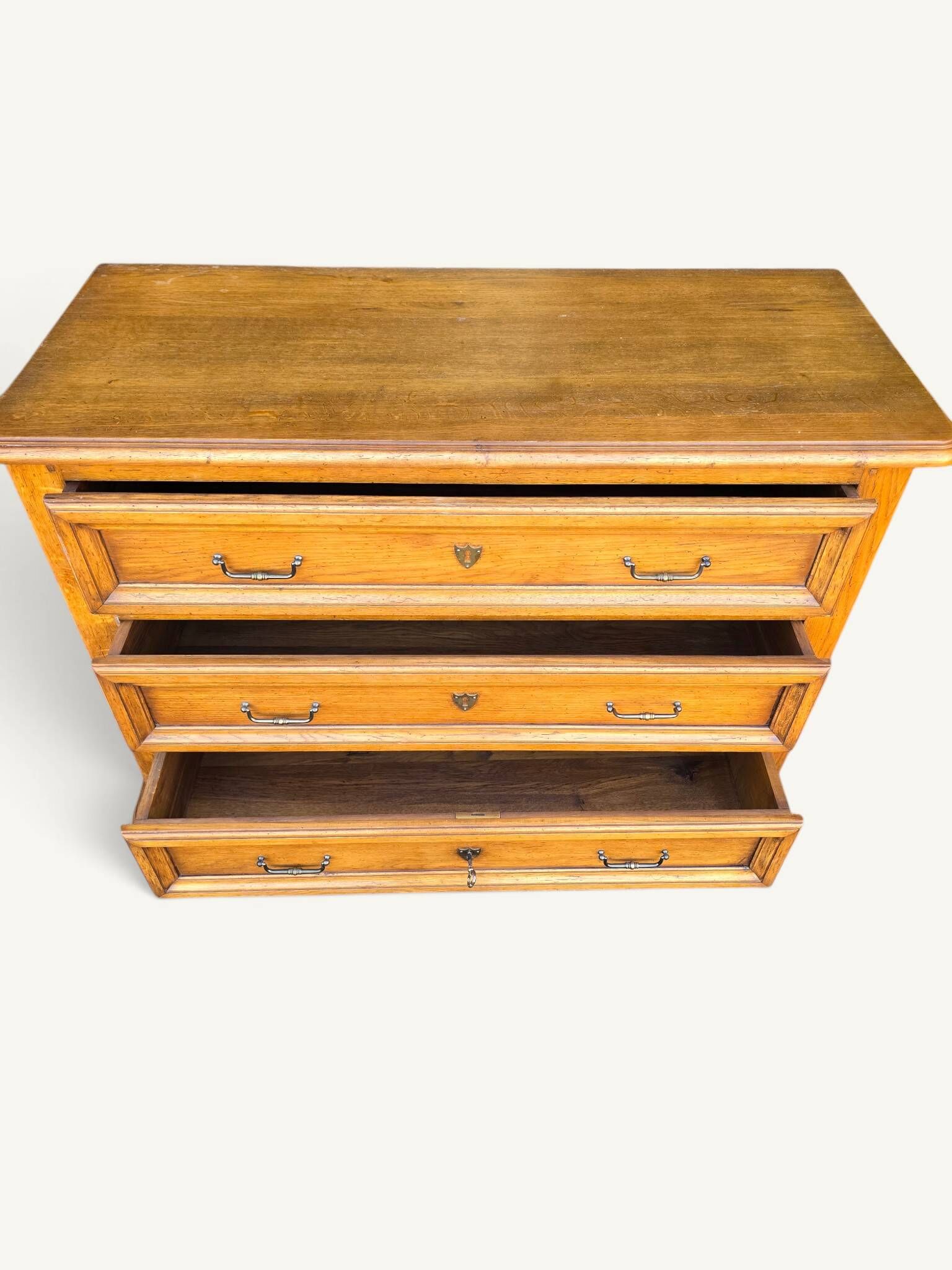 Antique oak chest of drawers with three drawers in Louis XIII style.