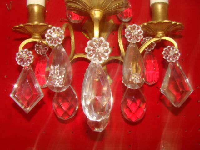 Pair of bronze and crystal wall lights with three candle holders from the early 20th century.