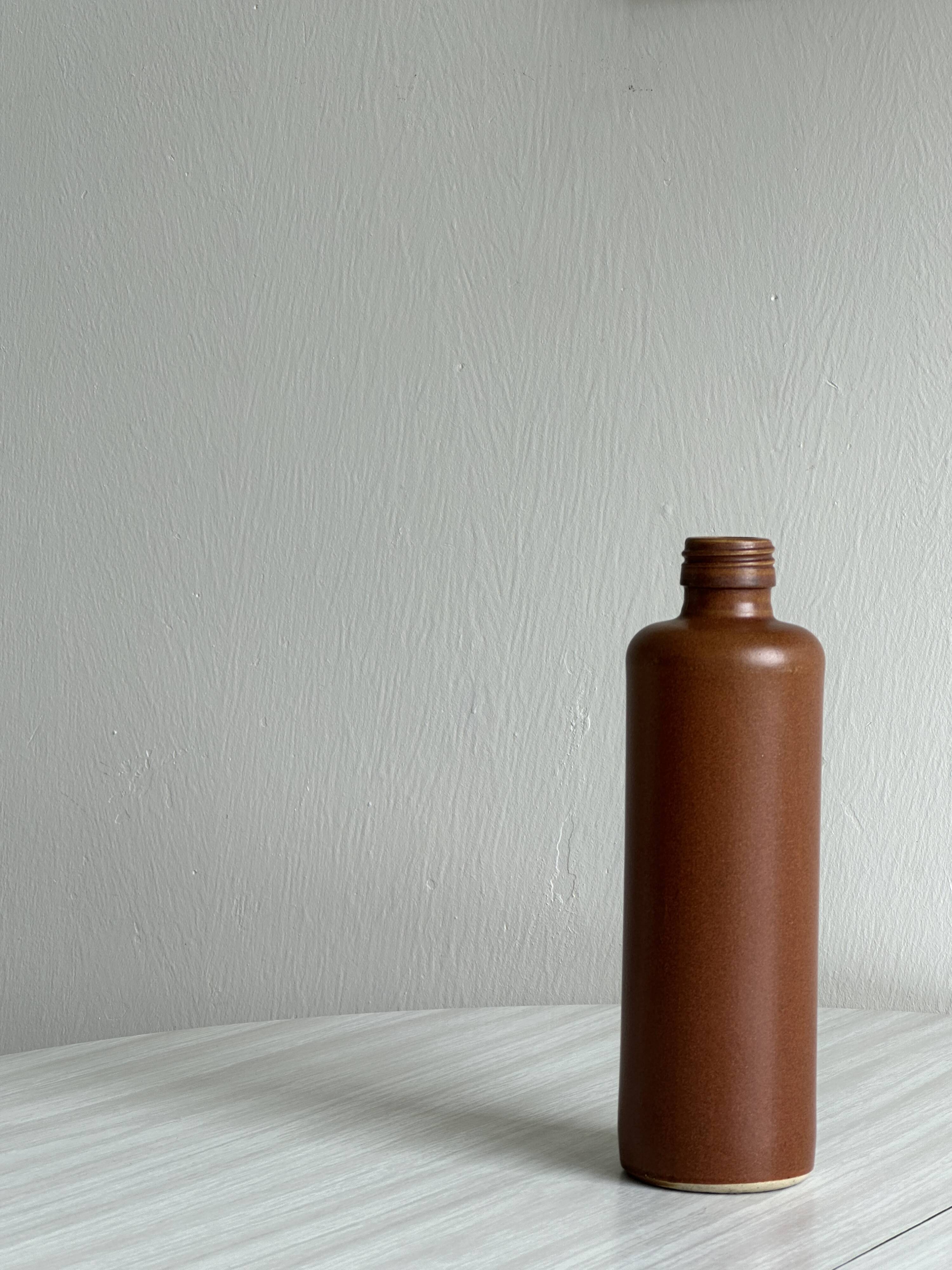 Decorative brown ceramic bottle.