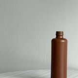 Decorative brown ceramic bottle.
