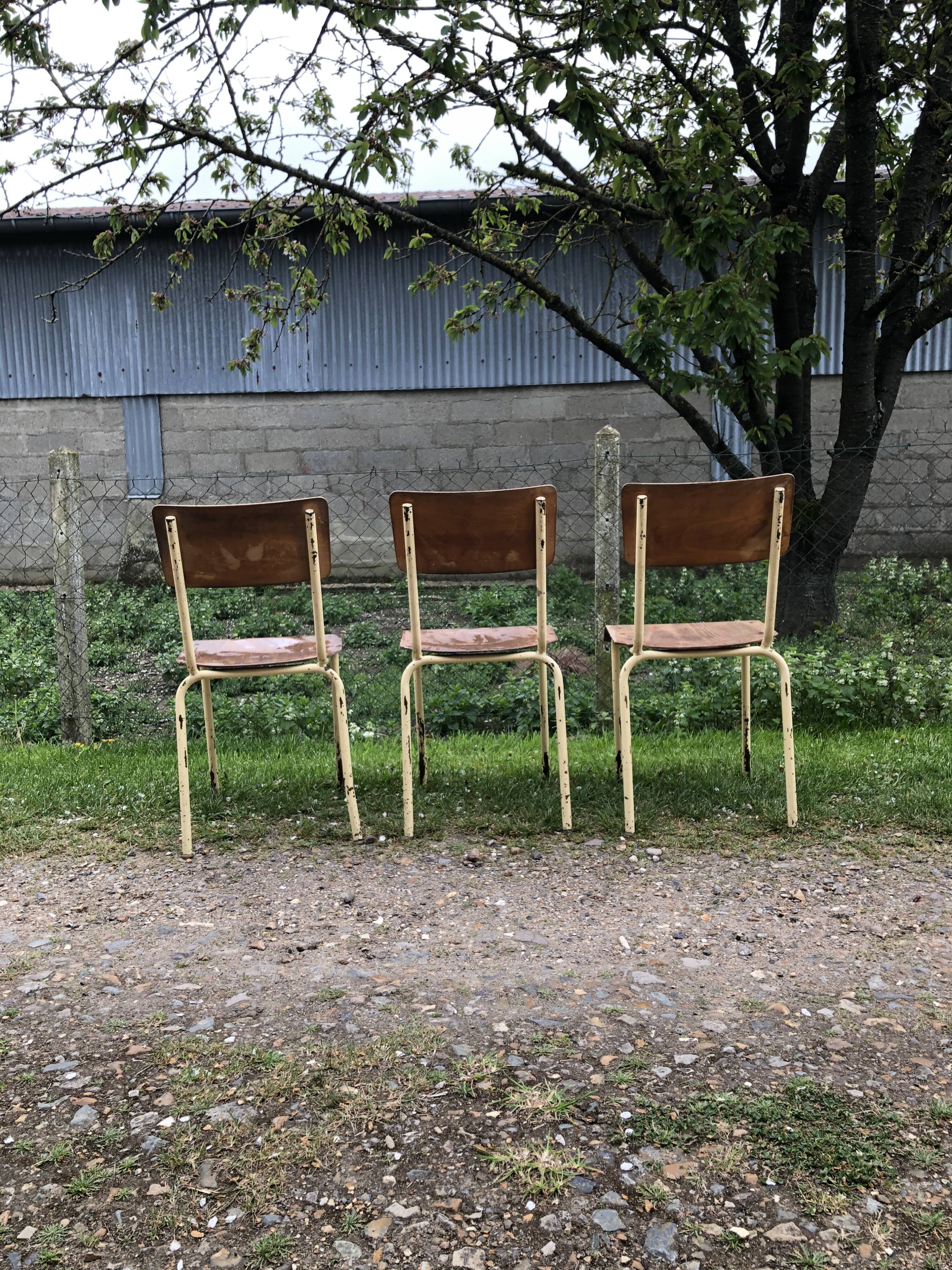 Three vintage school chairs