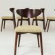 Green and walnut fabric dining chairs