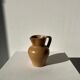 Pitcher in light beige sandstone