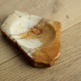 Empty pocket in orange and white marble ashtray