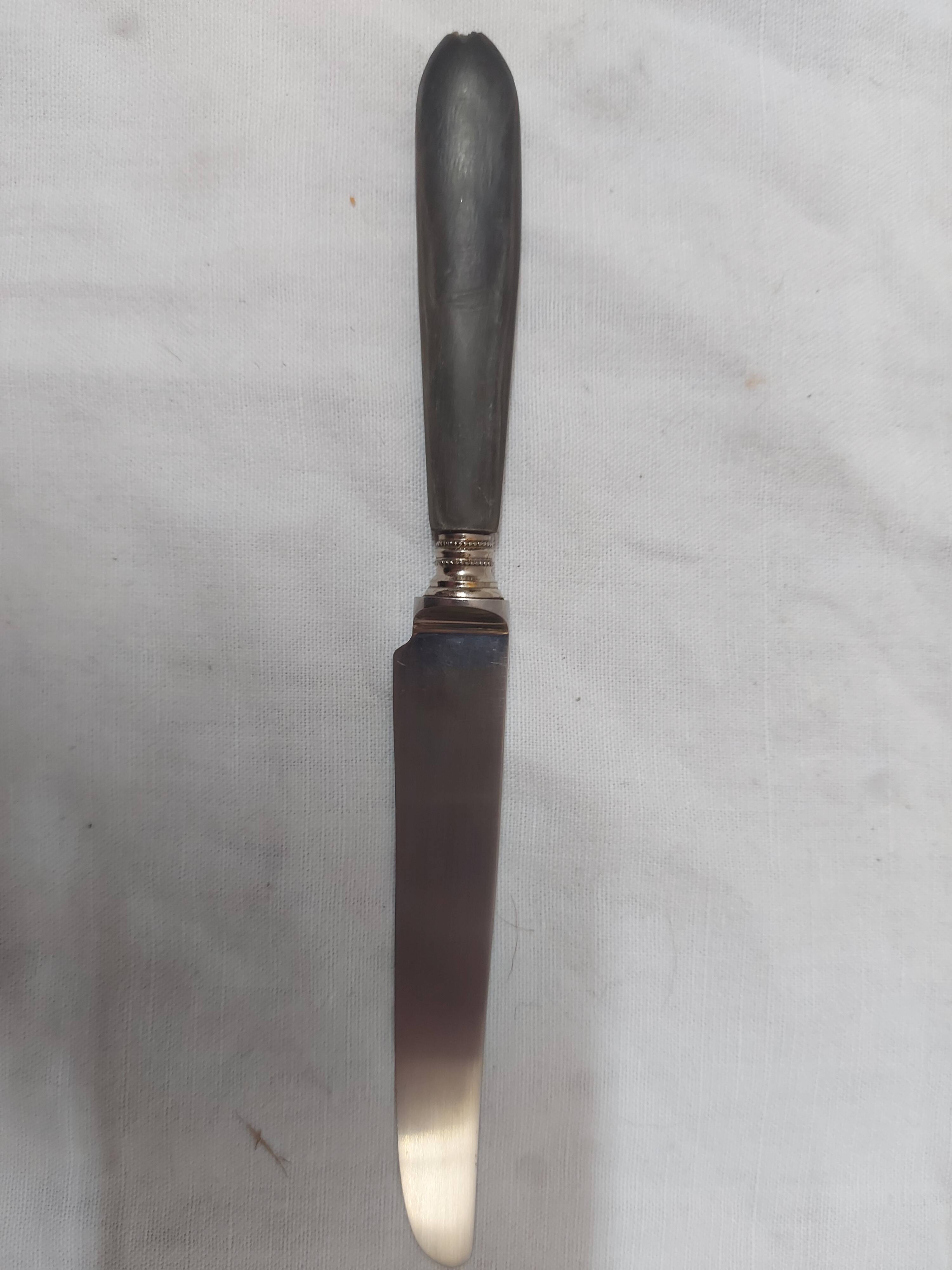 12 ebony handled knives, 1950