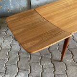 Extendable teak dining table