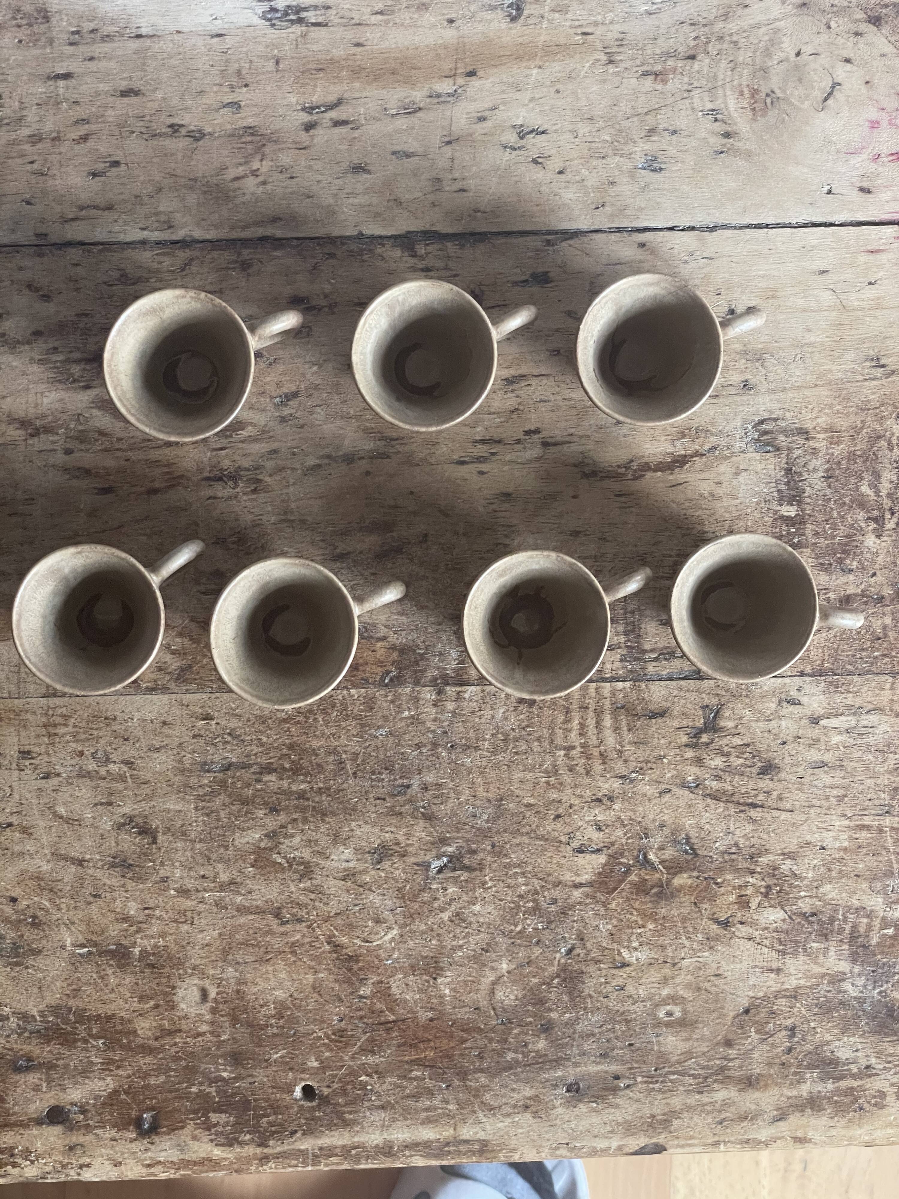7 very small old sandstone coffee cups