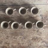 7 very small old sandstone coffee cups
