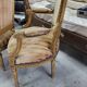 Paire de fauteuils en bois dore style Louis XVl