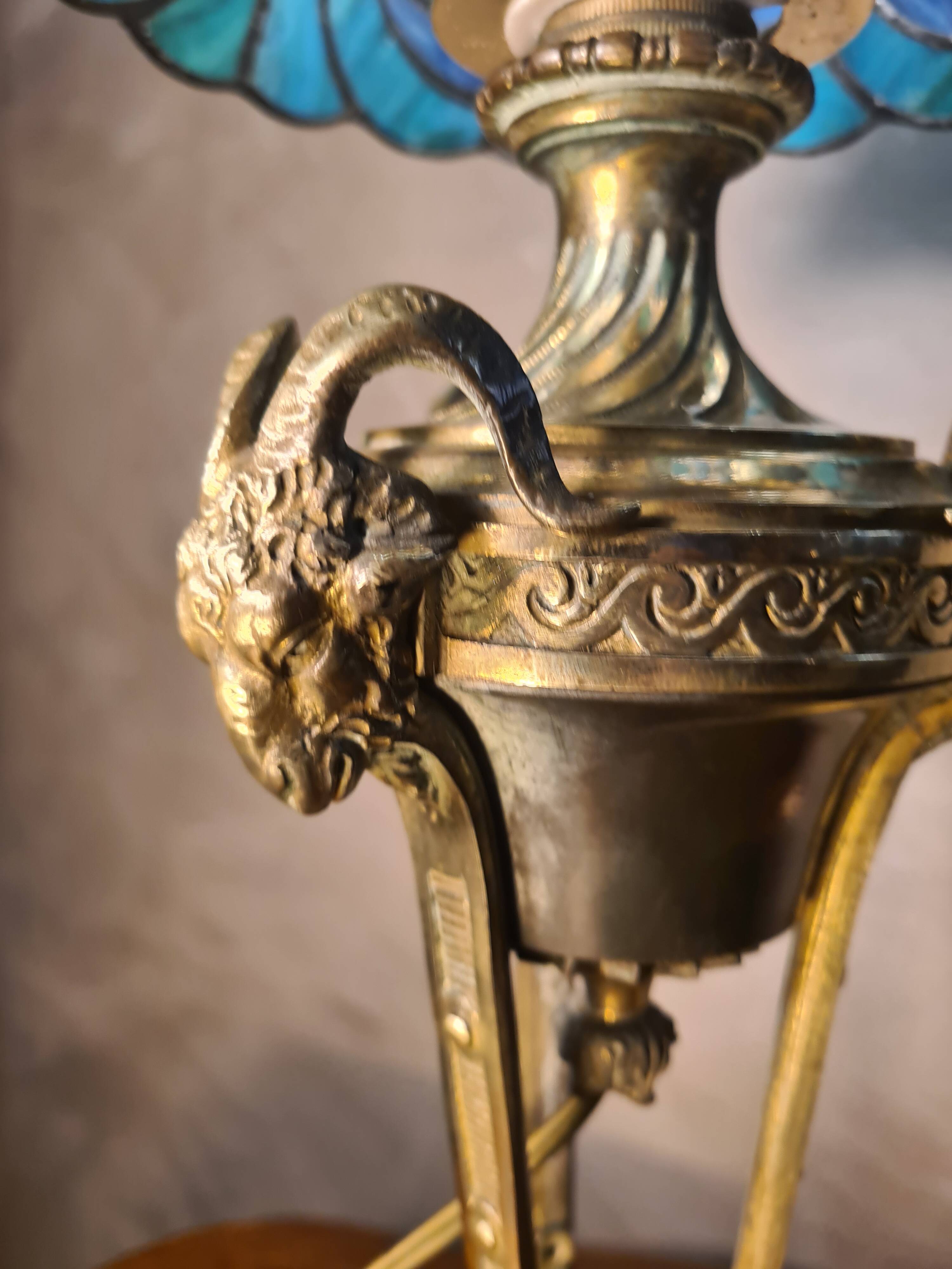 bronze lamp with a goat's head from the 19th century and a stained glass lampshade soldered with lead