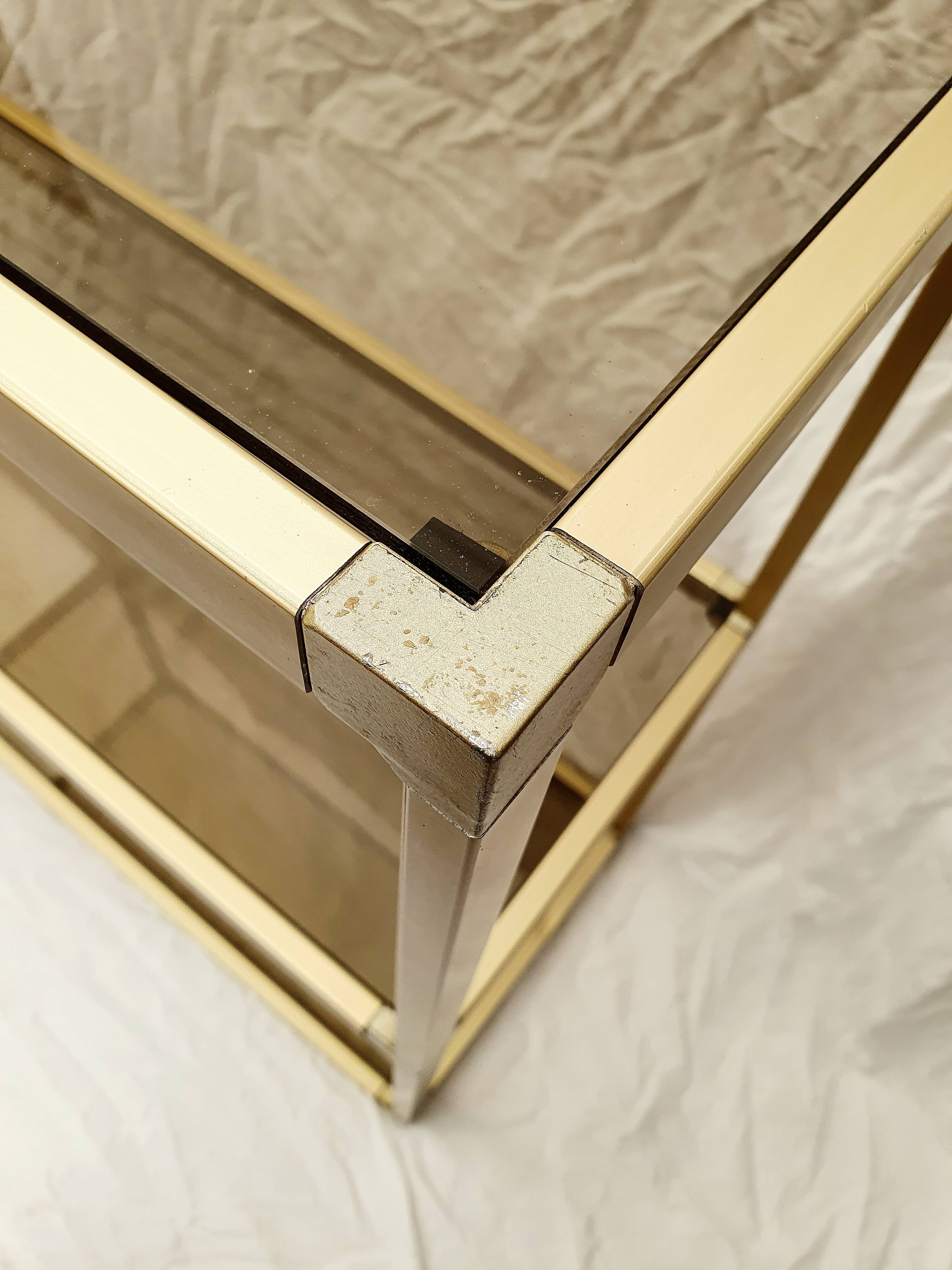 Golden metal shelf and smoked glass