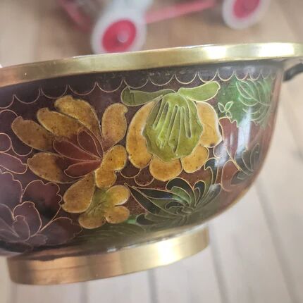 Vintage Asian brass bowl with floral decoration.