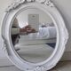 Antique oval mirror in painted wood