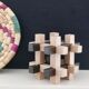 Casse tête sculptural en bois années 70