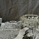 Circular glass ashtray with stylized petal patterns