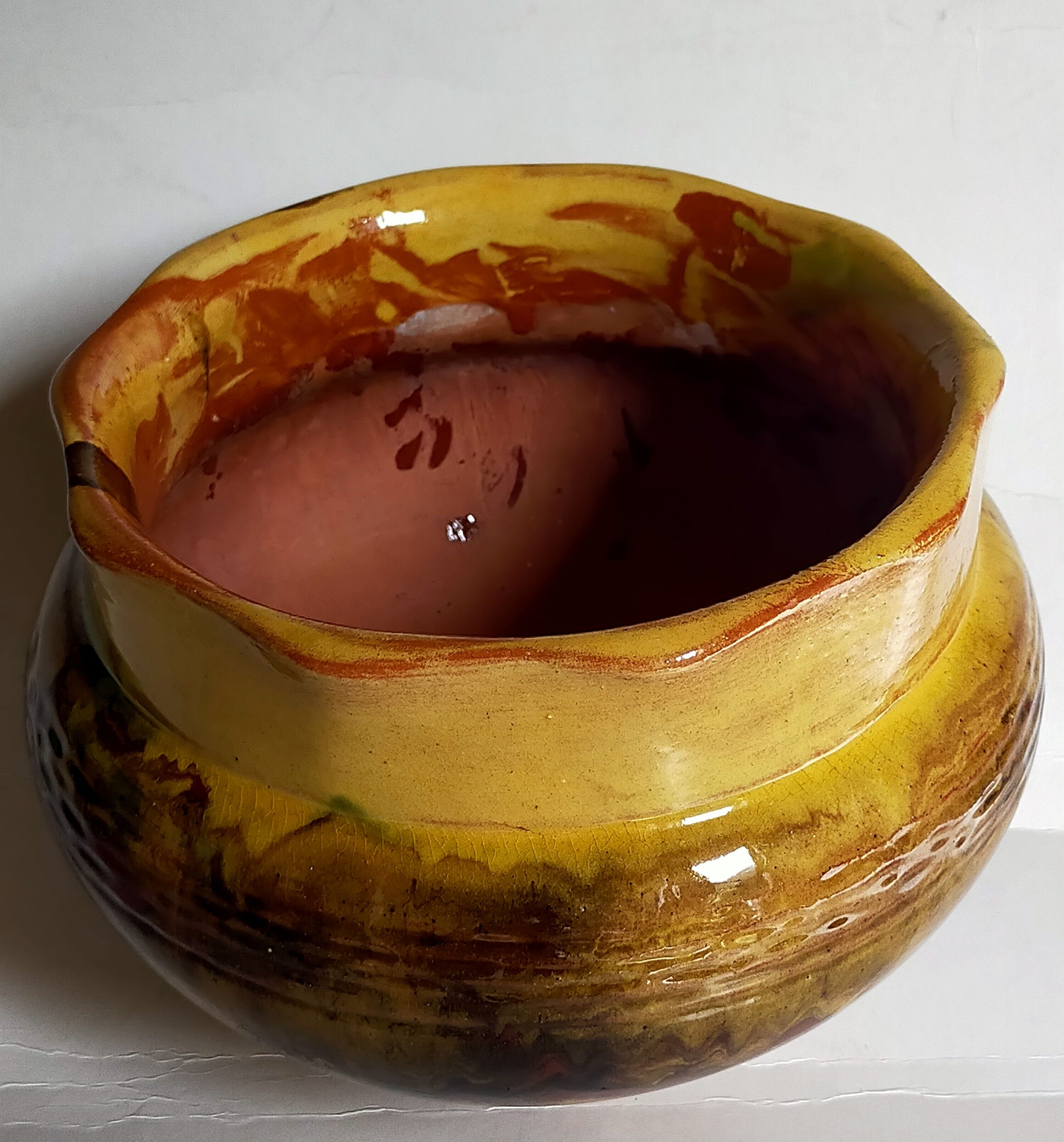 Old provencal pot cover in glazed terracotta