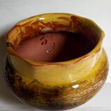 Old provencal pot cover in glazed terracotta