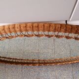 Oval mirror with woven rattan frame 63x47