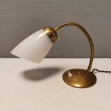 Beautiful table lamp, estimated from the 1950-60s. Made of metal, brass and glass.