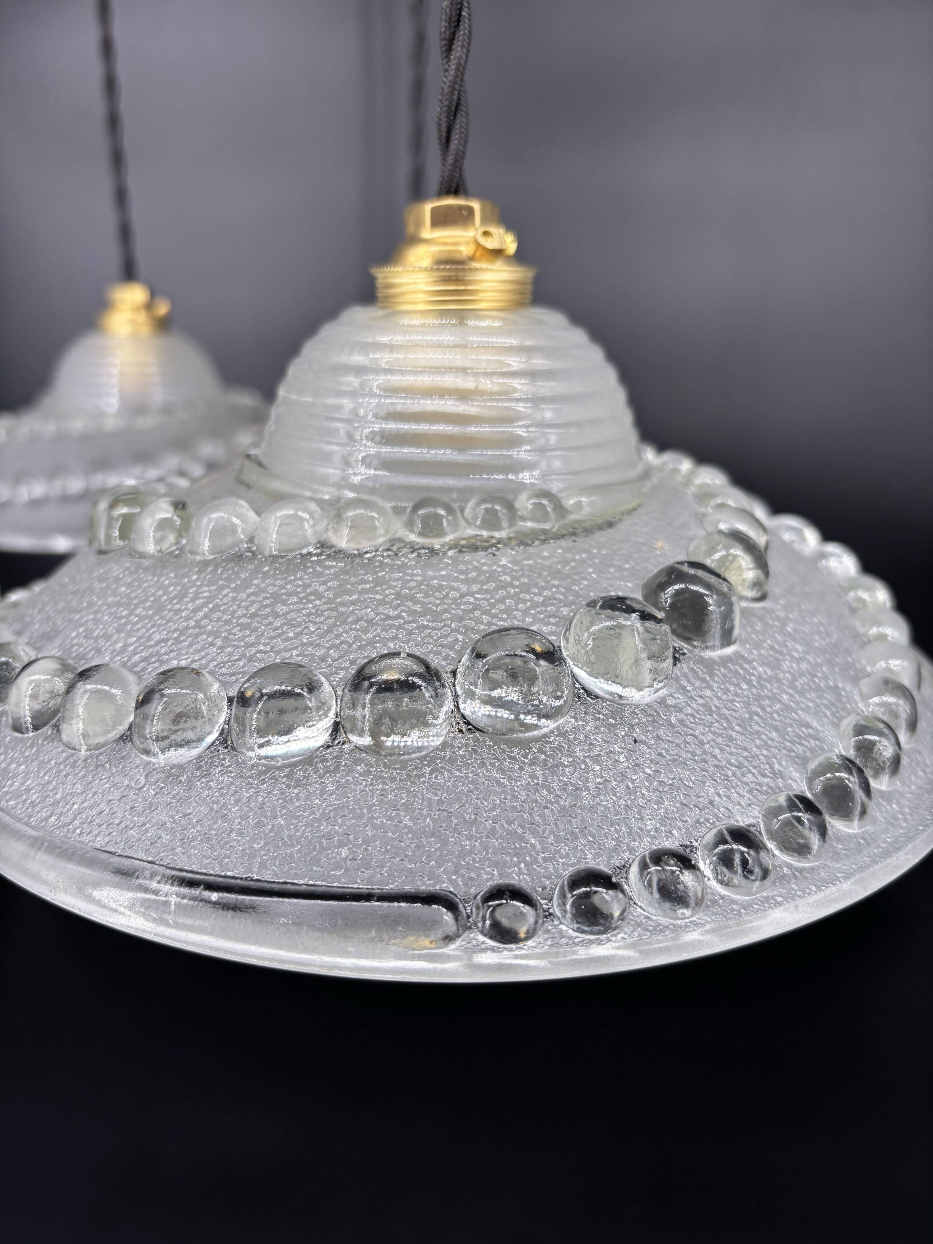 Set of 3 moulded glass pendant lights with cabochons, Art Deco style Ezan.