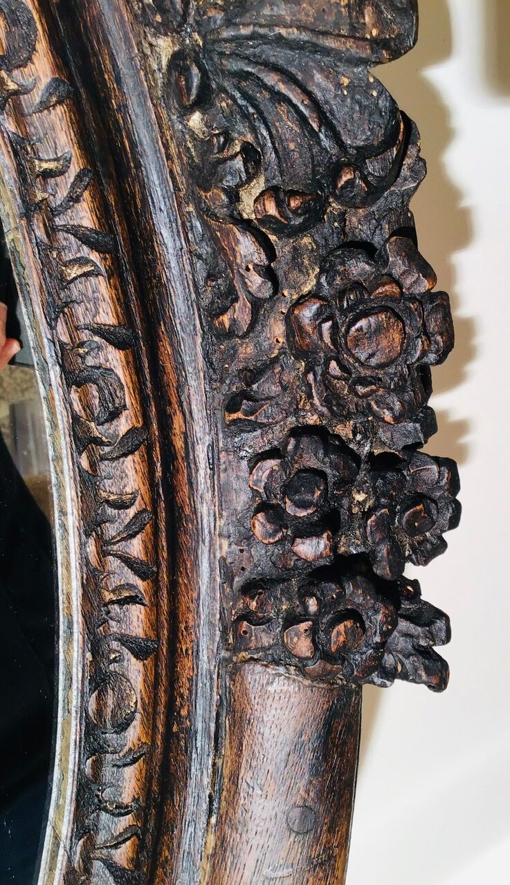 Oval mirror on an 18th century frame