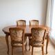 Oval table and 4 chairs in Louis XV style made of wood.