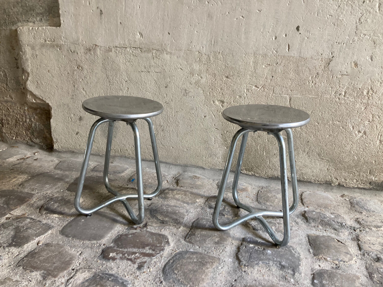 2 Habitat stools in cast aluminum