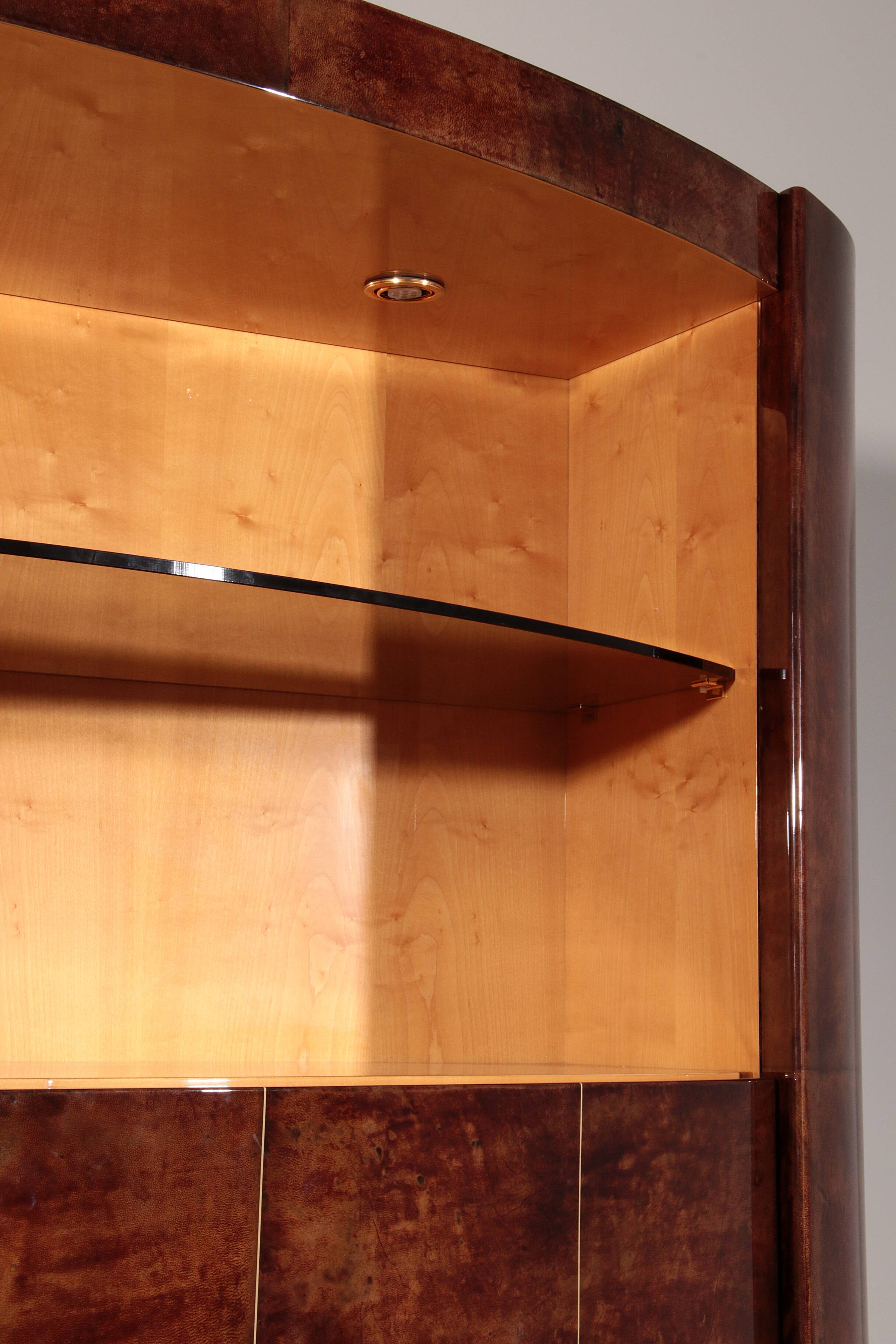 Iconic Aldo Tura brown goatskin bar cabinet with electric lift & mirror interior.