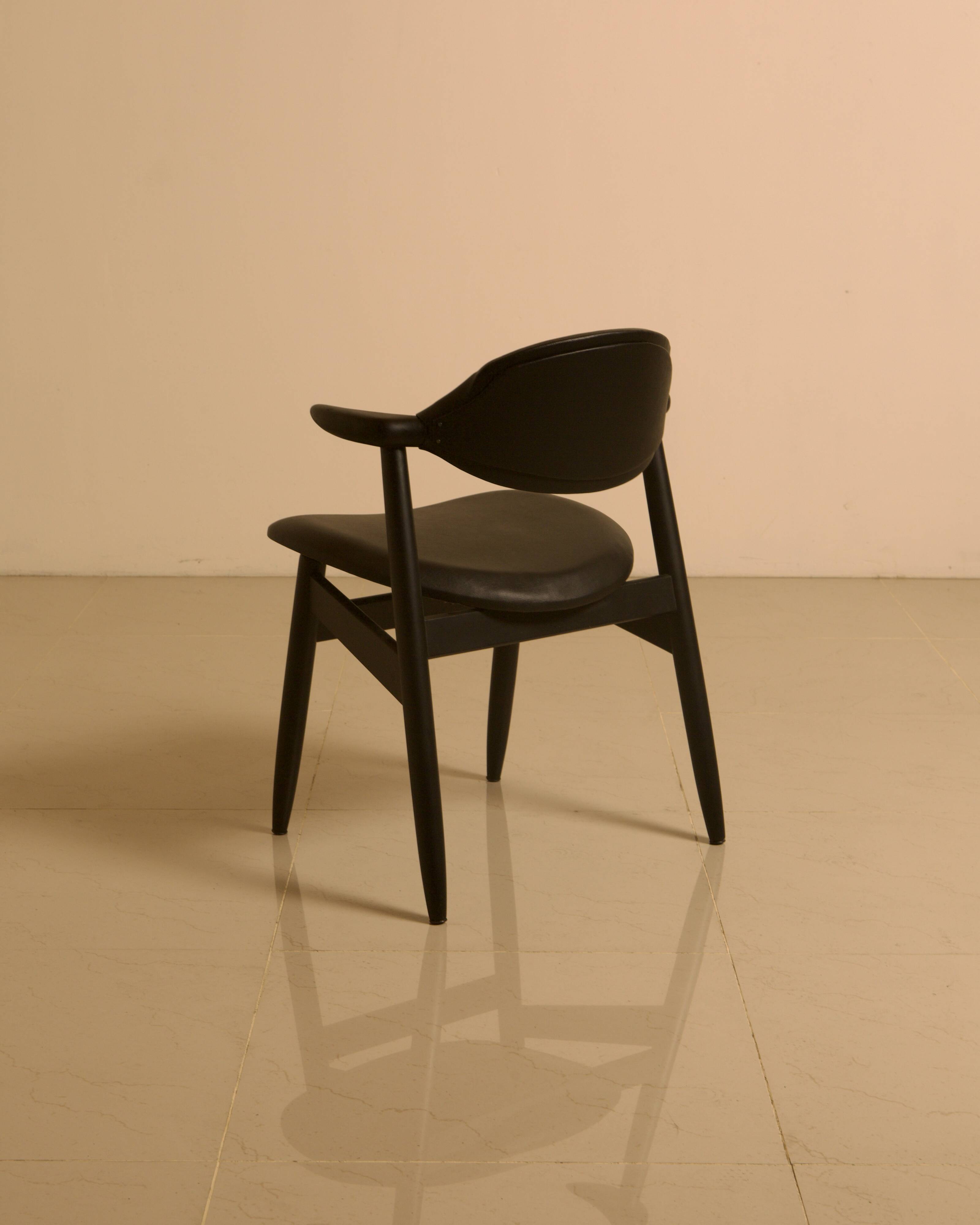 Dutch "Buffalo" armchair in wood and black leather from the 60s.