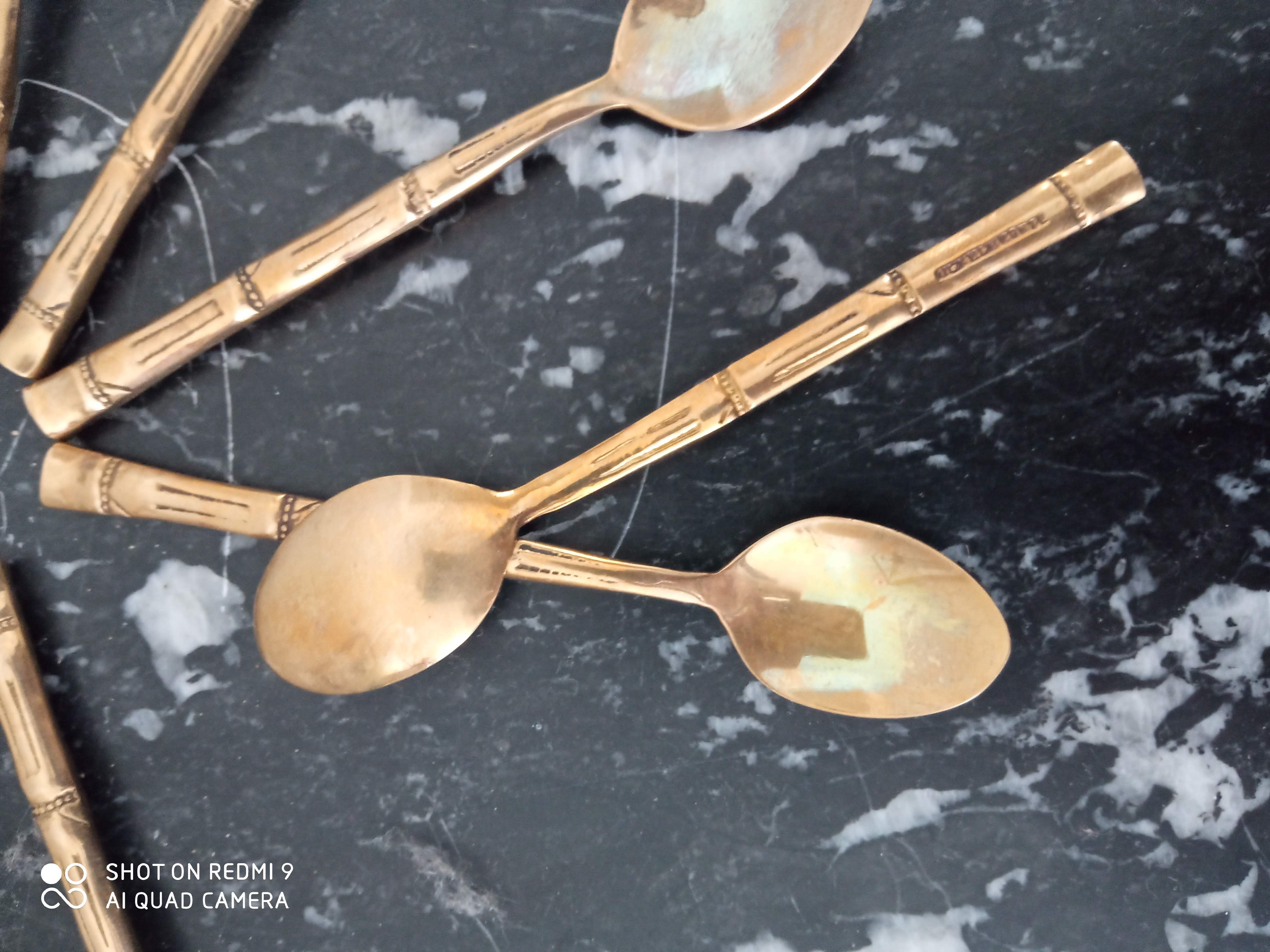 Set of 12 old brass teaspoons