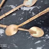 Set of 12 old brass teaspoons