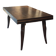 Solid oak dining table with integrated extensions.