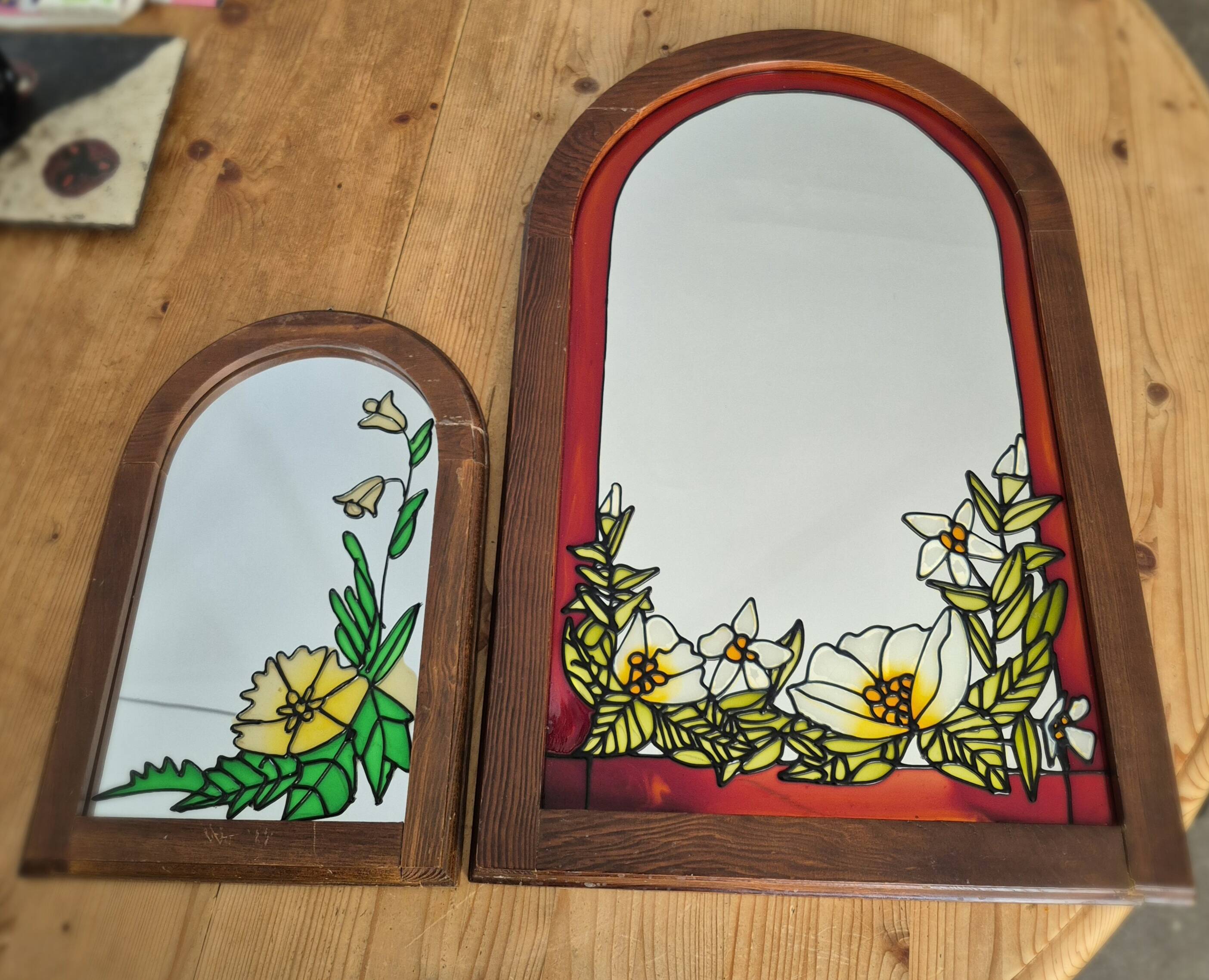 A pair of vintage stained glass style mirrors.