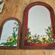 A pair of vintage stained glass style mirrors.
