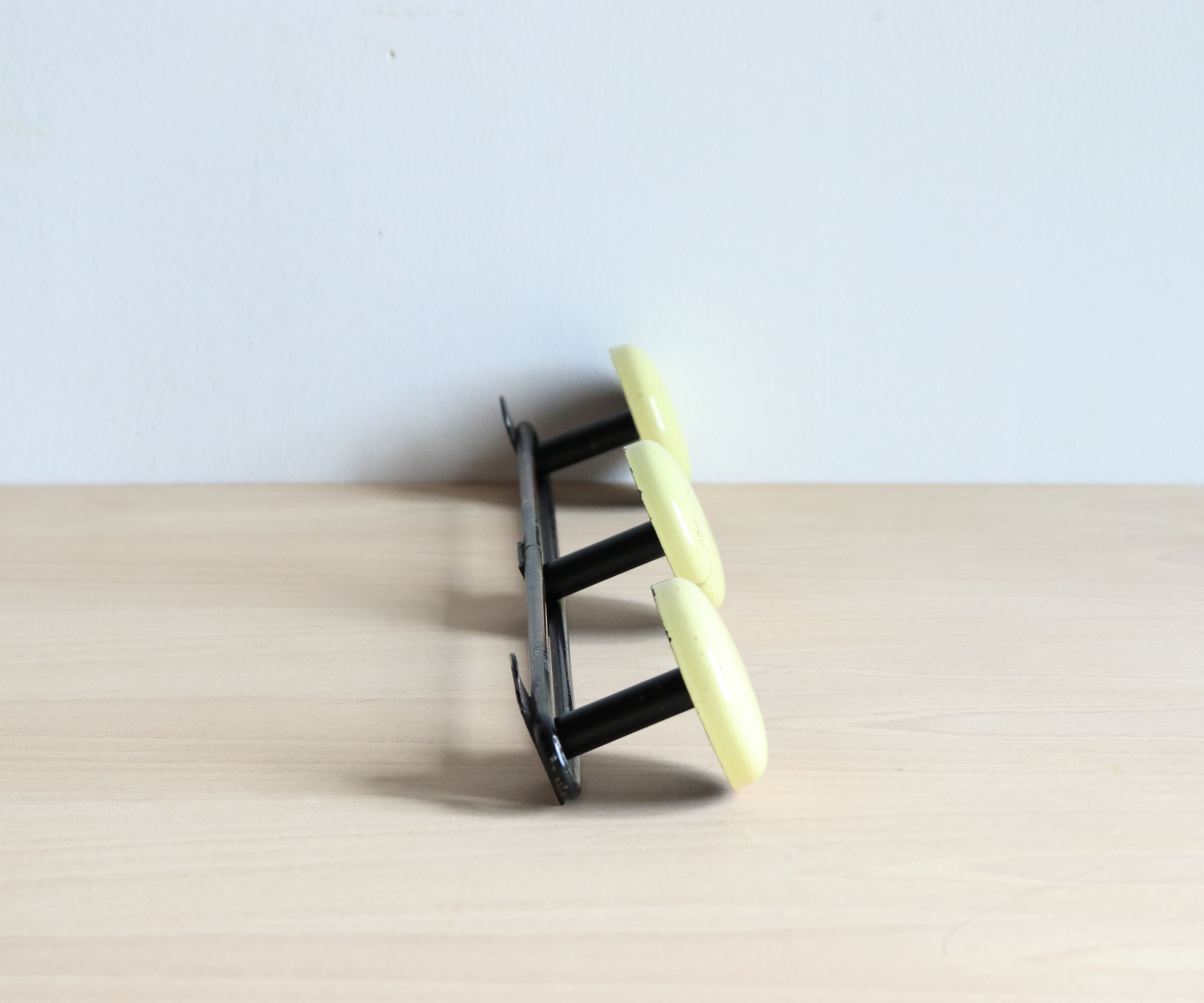 Wall doorpiece three black metal and yellow sheet metal