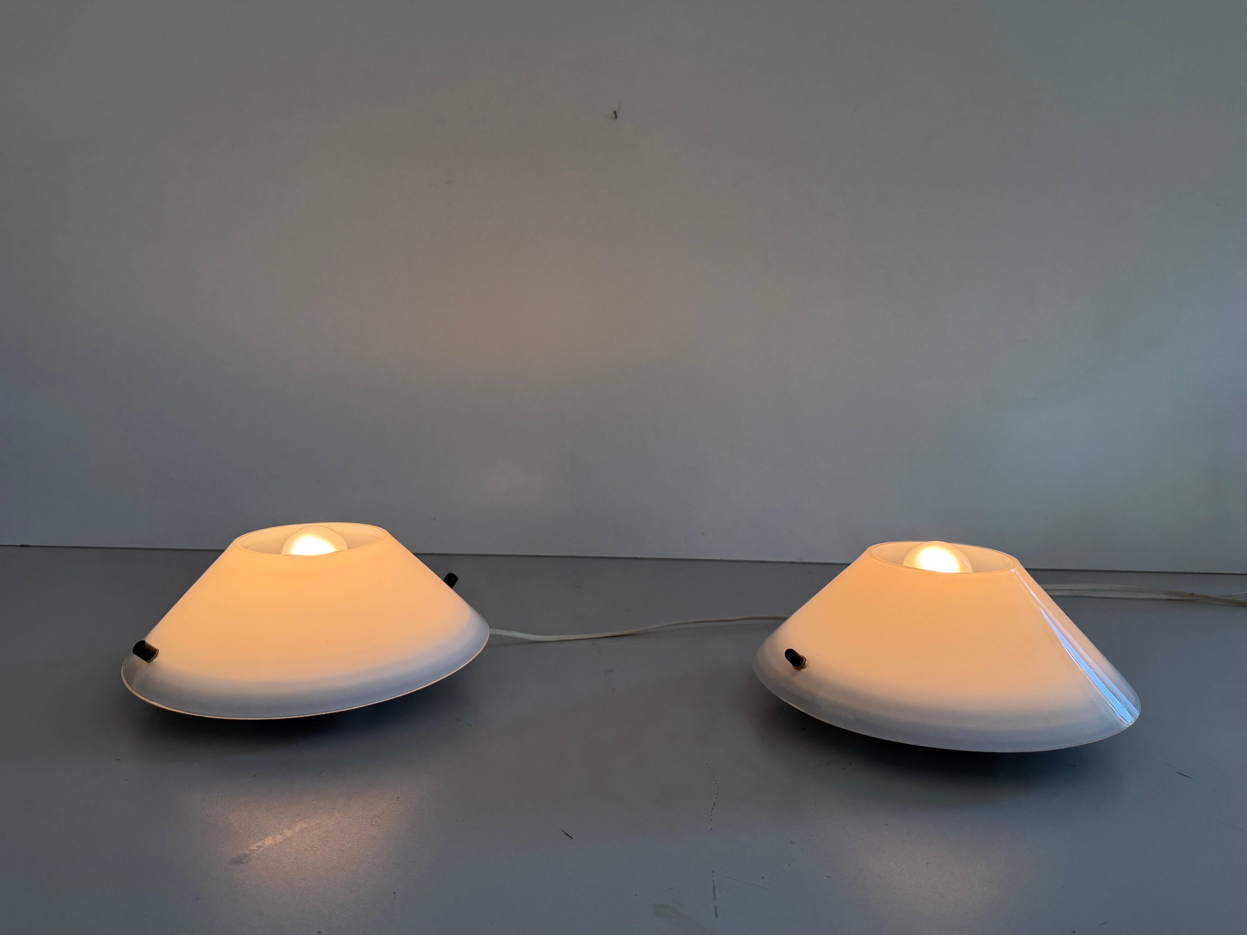 Pair of opal glass wall lights from the mid-century by Lamperti, 1960s, Italy.