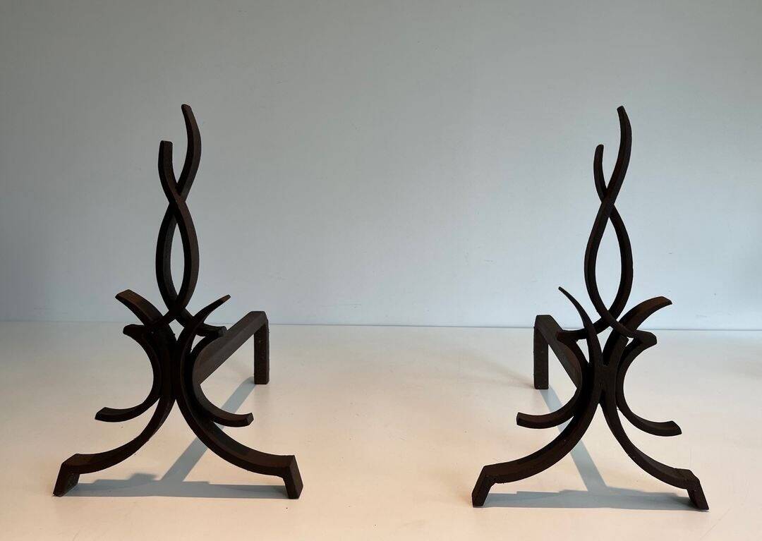 Pair of Wrought Iron Andirons with Stylised Flamboyant Uprights and Enrobed Feet