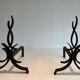 Pair of Wrought Iron Andirons with Stylised Flamboyant Uprights and Enrobed Feet