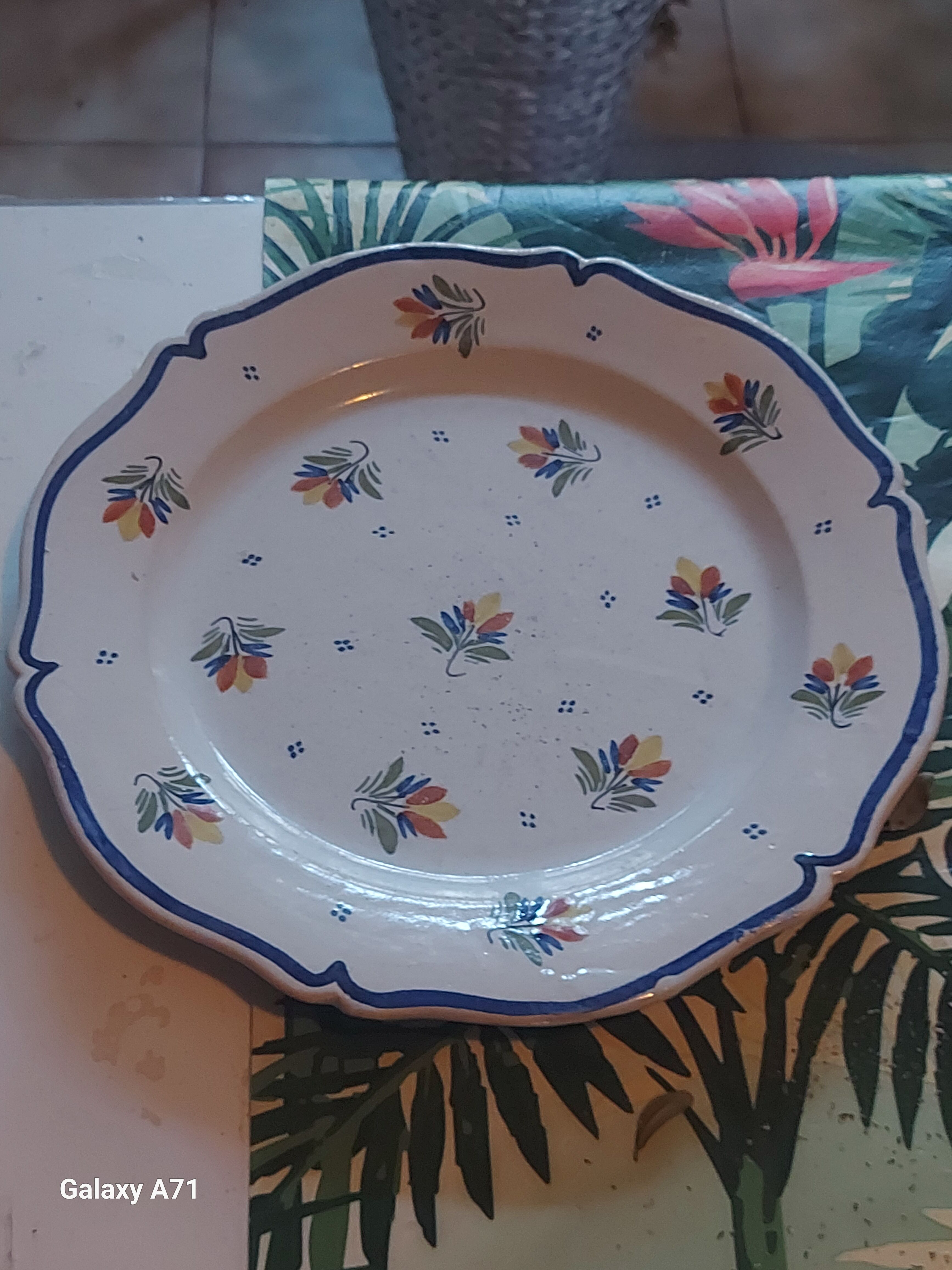 Decorative faience plate from Quimper signed Henriot