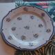 Decorative faience plate from Quimper signed Henriot