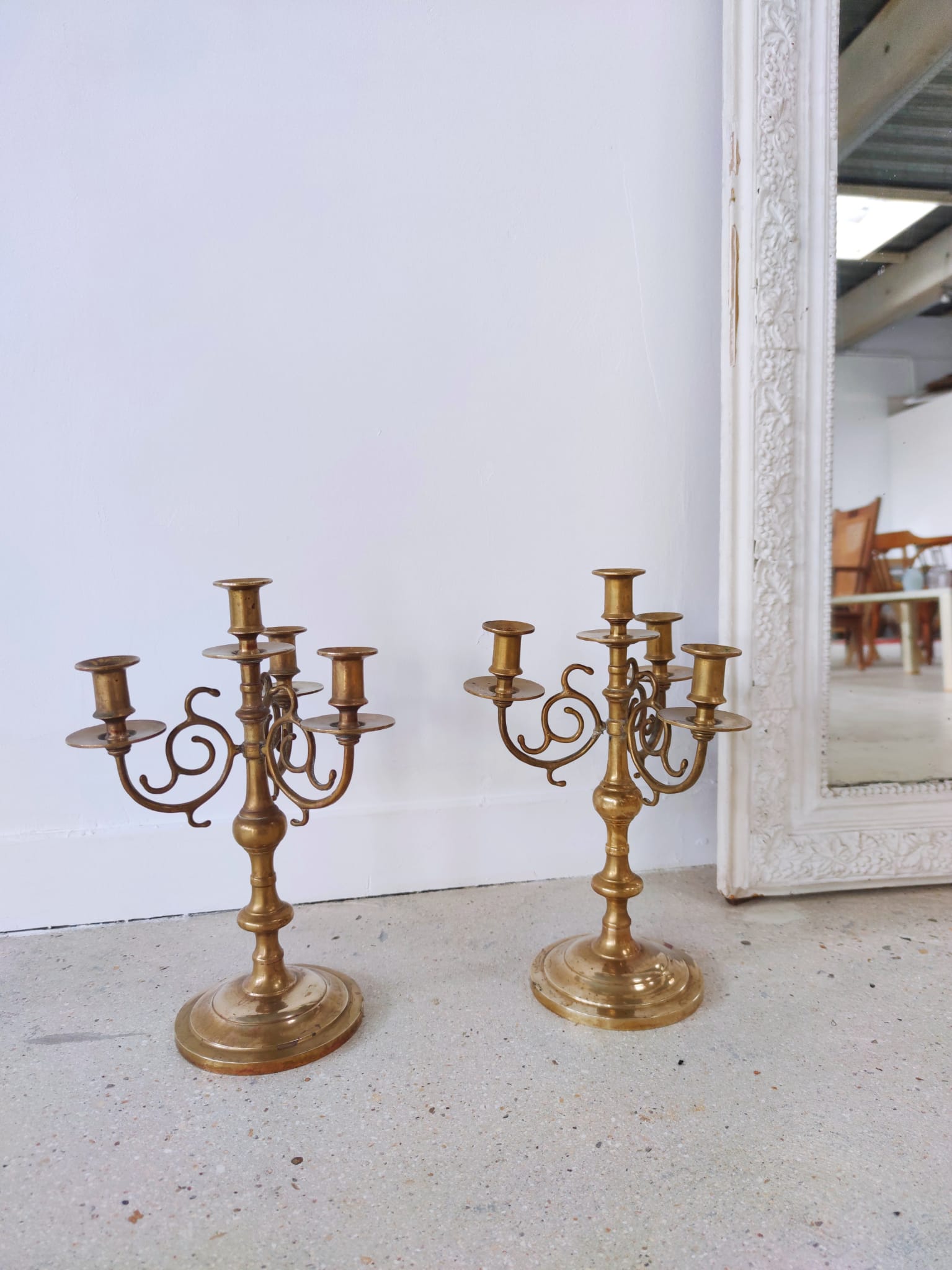 Pair of four-light candle holders in gilded brass