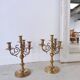 Pair of four-light candle holders in gilded brass