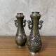 Pair of bronze vases - Asian motifs in relief in copper