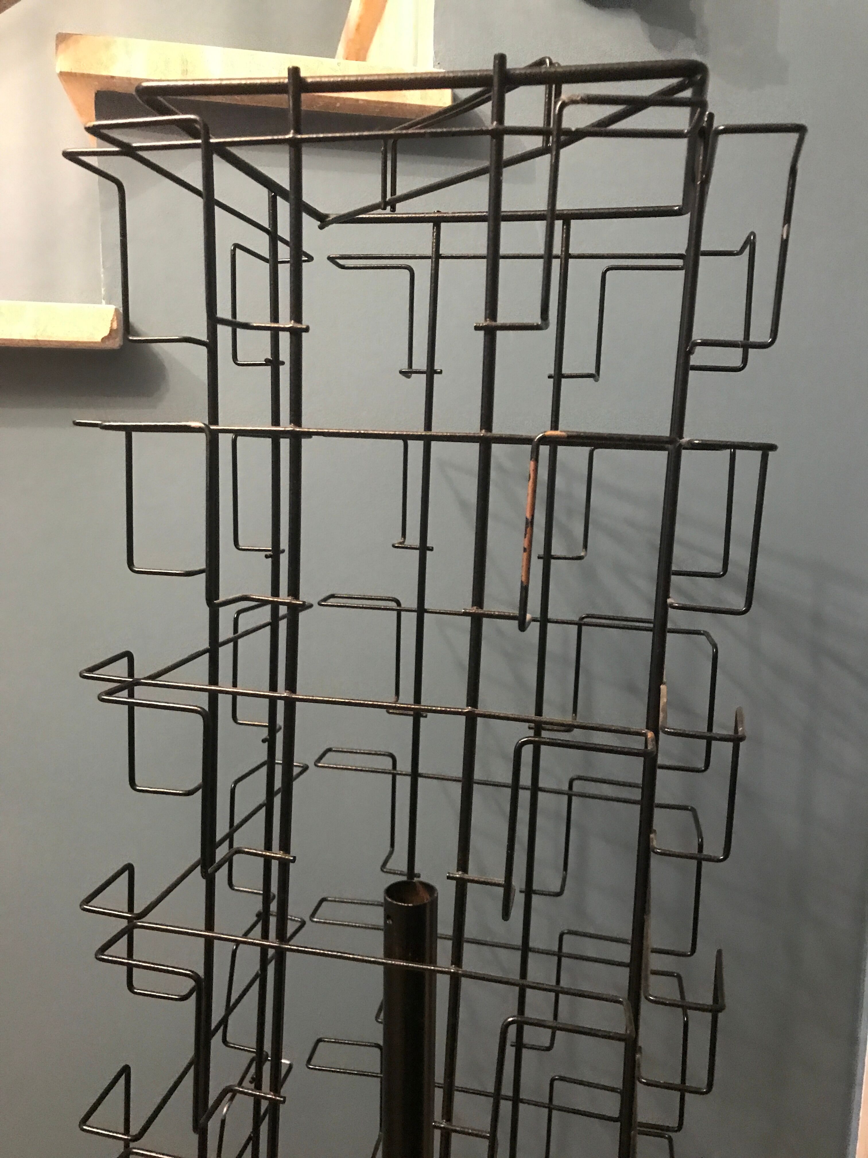 Display postcards and photos in black metal turnstile