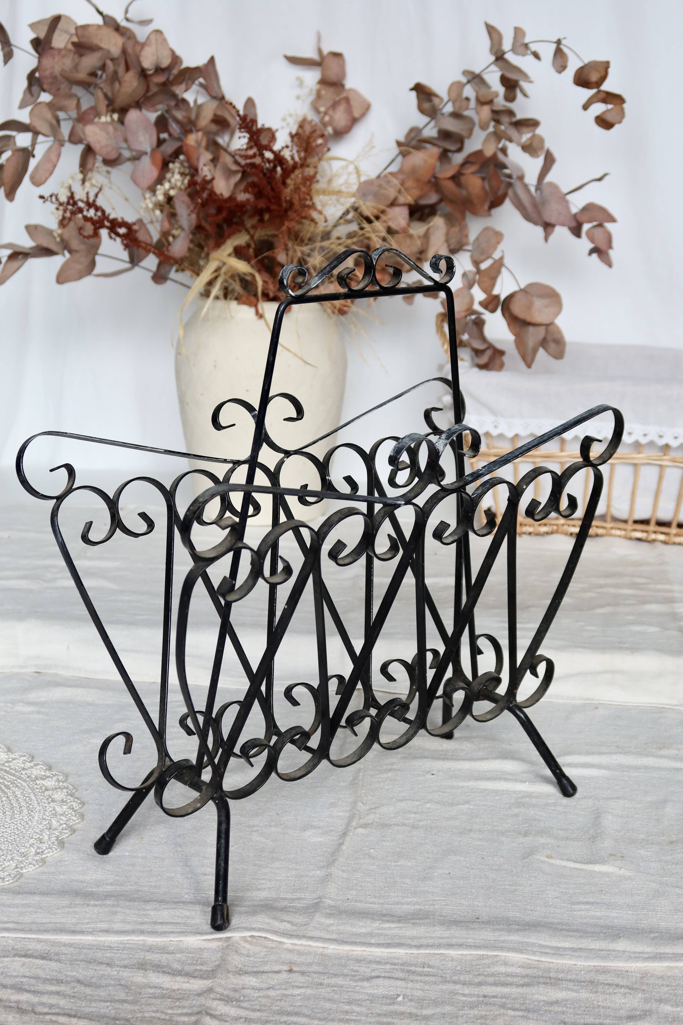 Vintage black metal scroll magazine rack