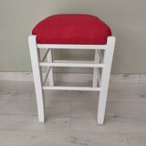 White pine stool with a red seat.