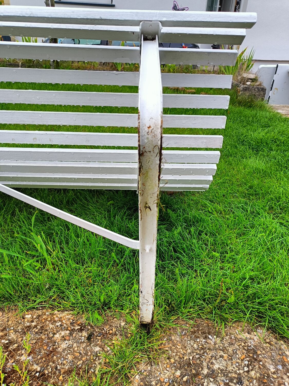 Antique garden bench with metal legs