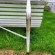 Antique garden bench with metal legs