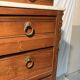 Antique carved wooden dressing table with marble and tilting oval mirror.
