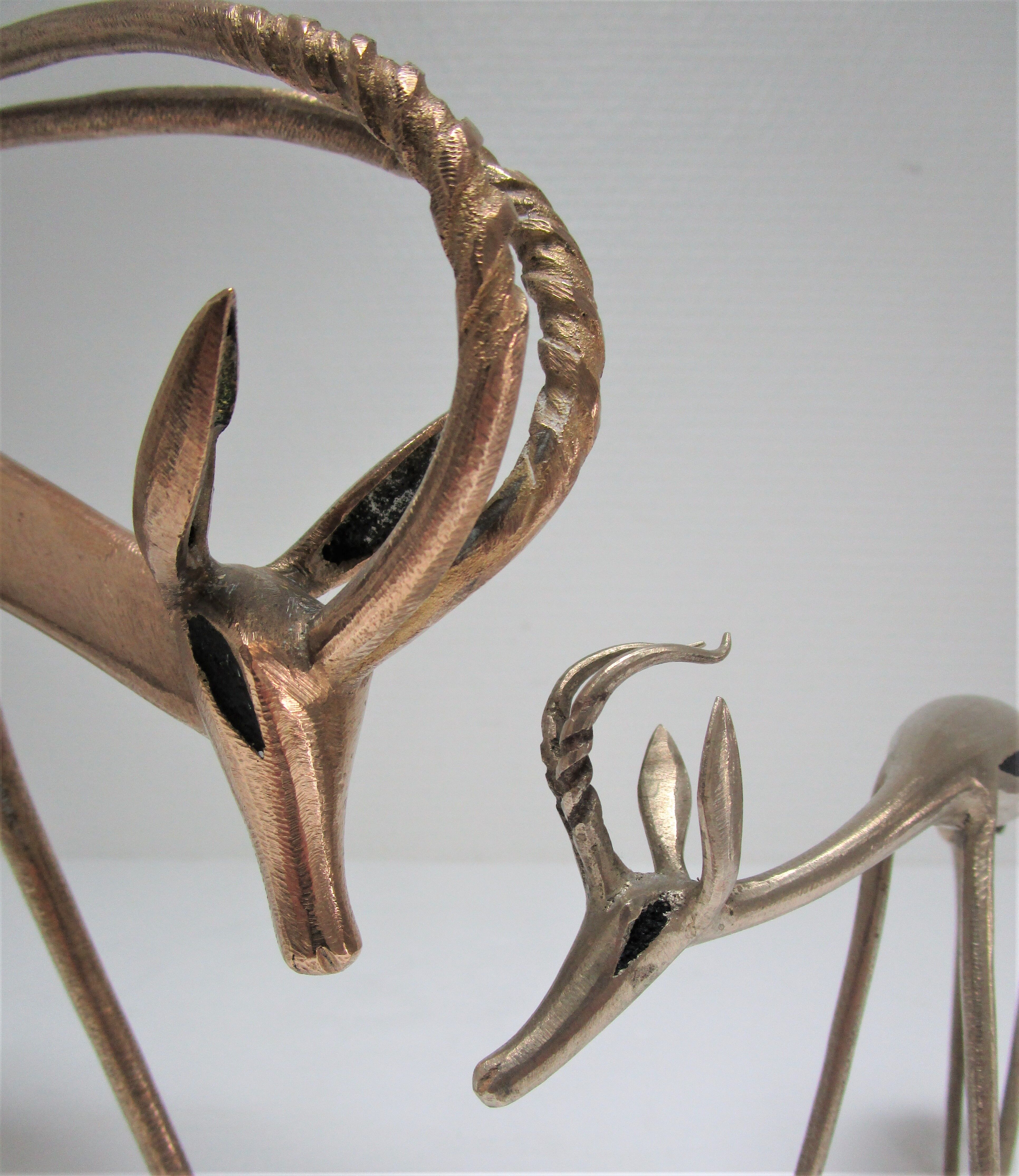 Four vintage brass antelope gazelles